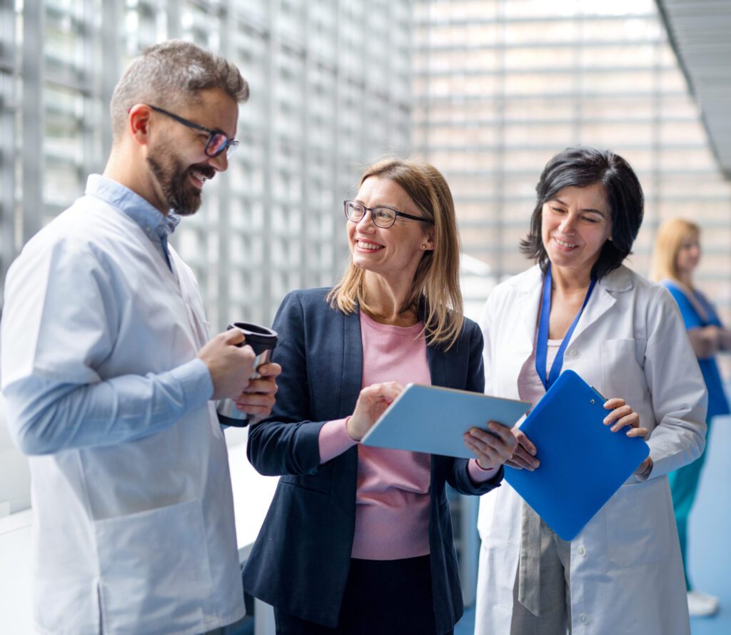 Group of doctors talking to pharmaceutical sales representative