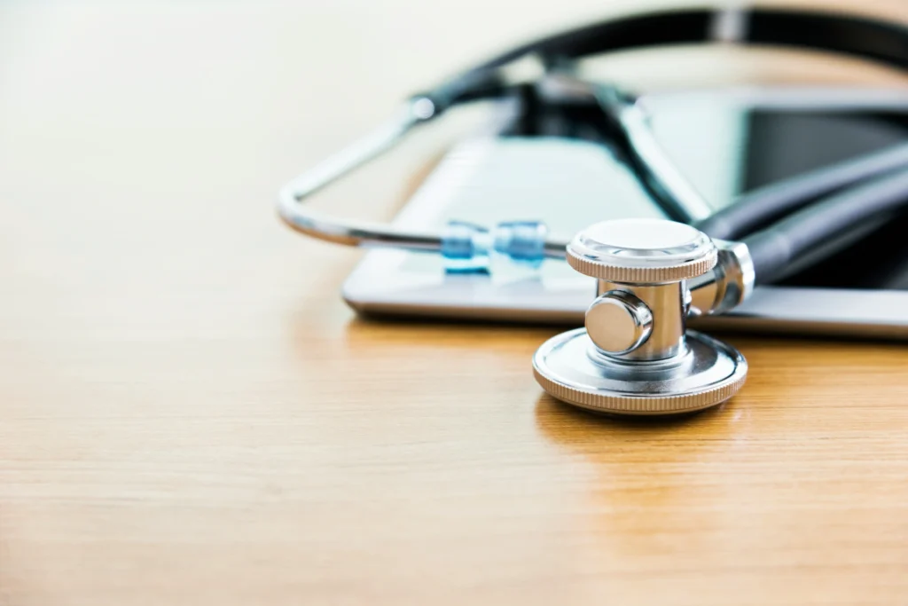 Healthcare file folder with a stethoscope representing medical records and patient care management