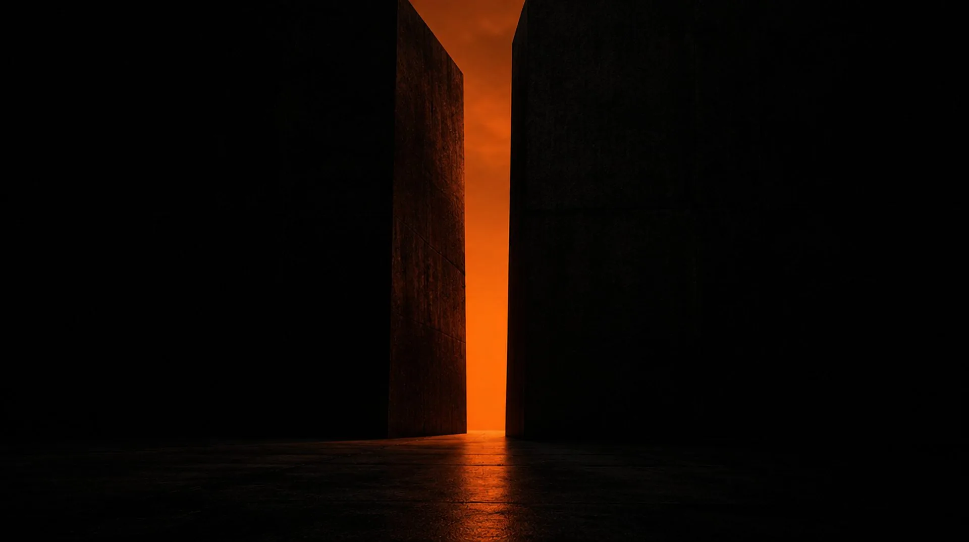 Narrow orange-lit gap between two dark walls