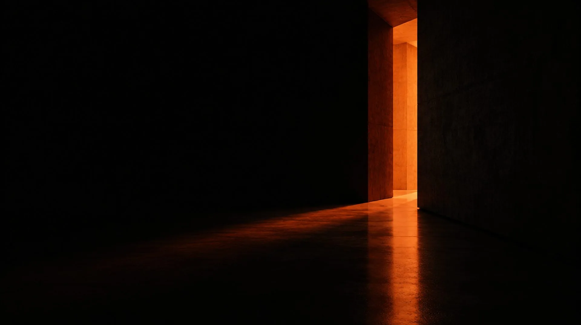 Orange light spilling through an open doorway into a dark room